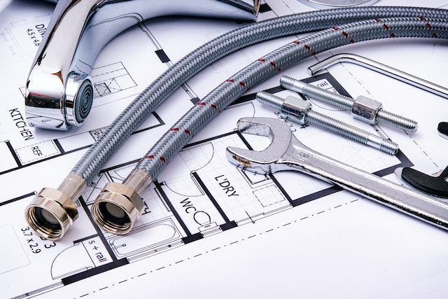pipes%20and%20wrenches%20on%20top%20of%20a%20homes%20blueprints